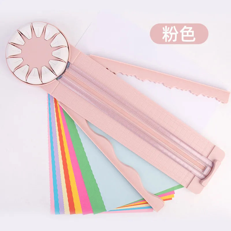 Pink plastic paper cutting machine with 12 pattern functions measuring 46.2 cm long