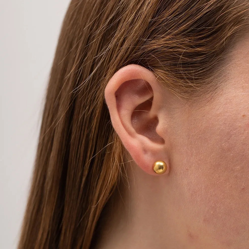 Stainless steel ball stud earrings in gold and silver finishes, showing 3mm, 4mm, 5mm and 6mm size comparison.