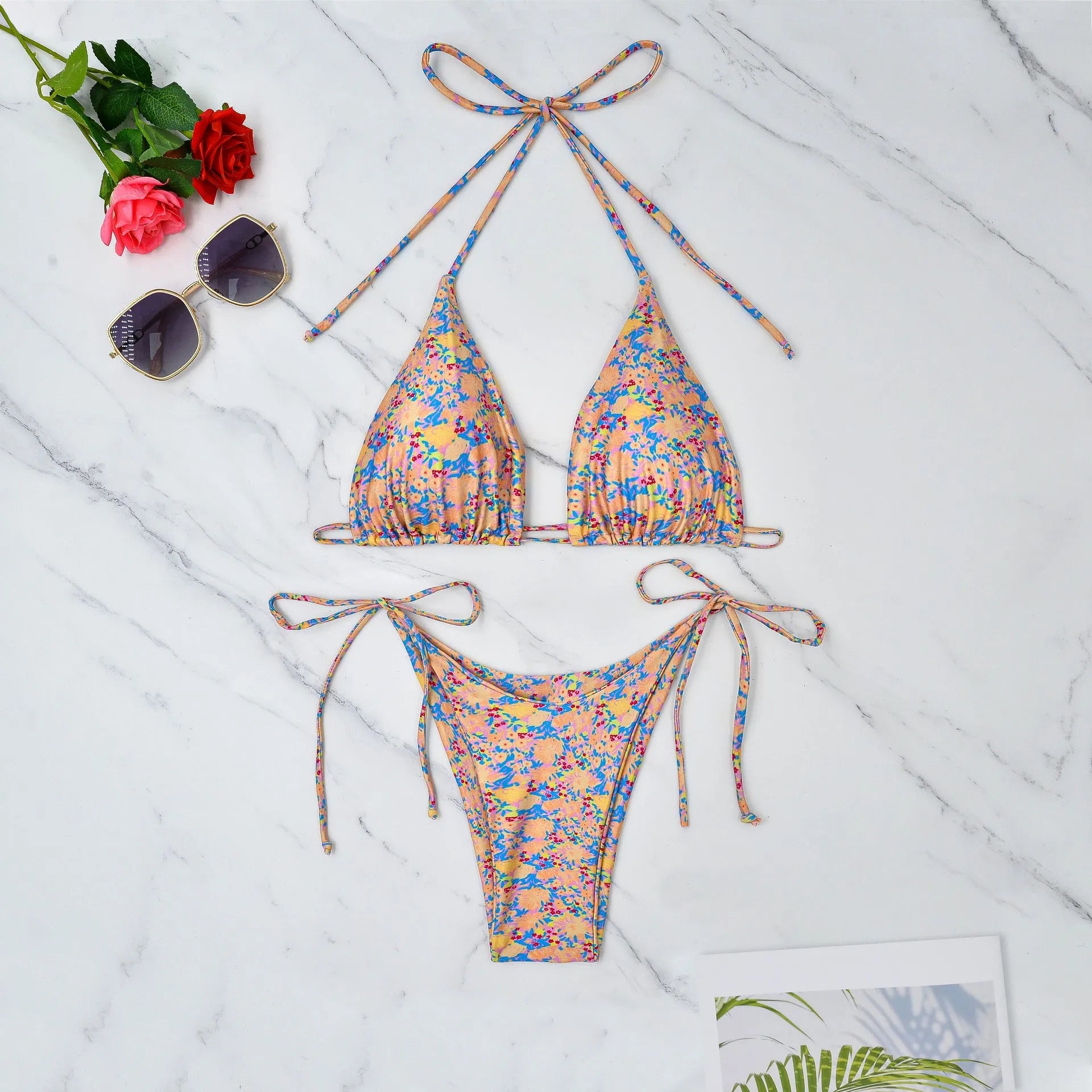 Lace-up front bikini top and briefs in picture colour, a polyester swimsuit set for water sports.