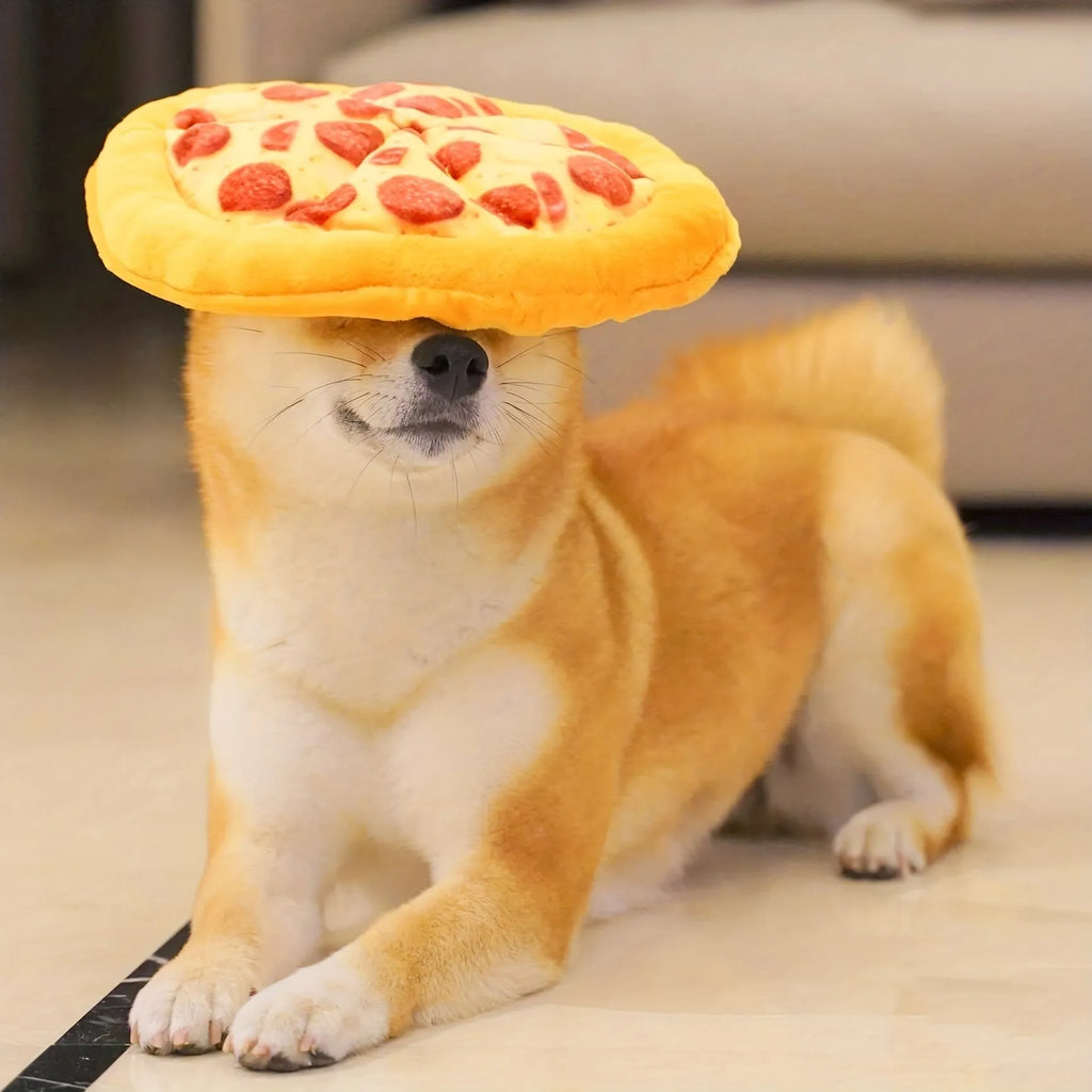 Yellow pizza slice dog chew toy with squeaker and dental grinding surfaces