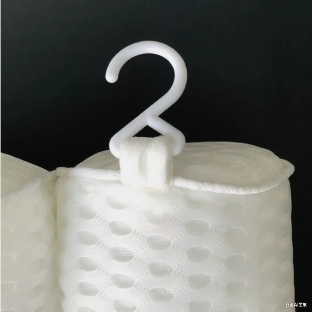 White rectangular bathtub pillow with a textured 3D mesh surface and large white suction cups on the back.