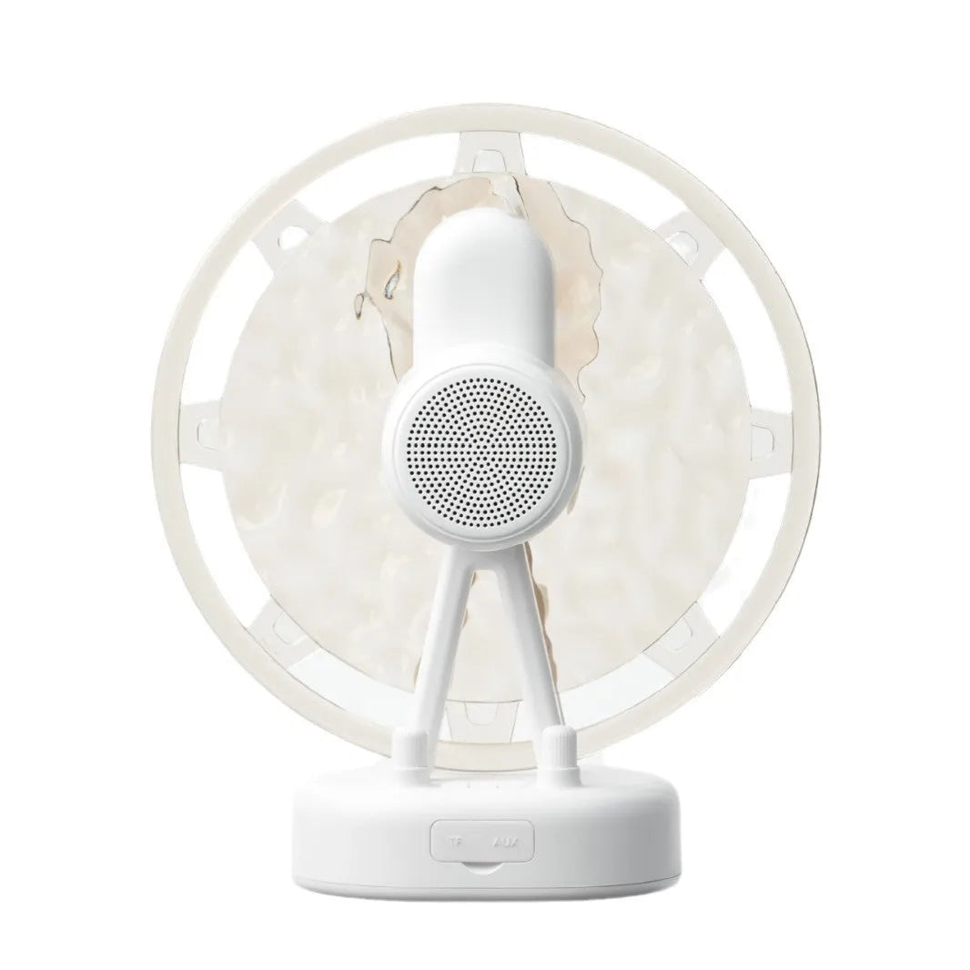 Ferris wheel water ripple Bluetooth speaker with colourful atmosphere light in pink on a white background