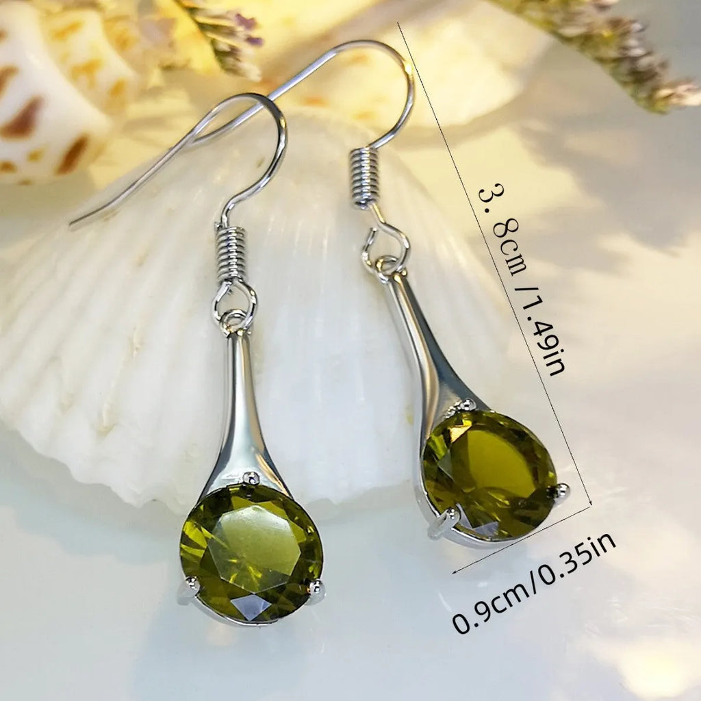 Olive green drop-shaped alloy earrings with posts on a white background.