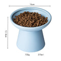 Ceramic elevated cat food bowl in blue, showing wide shallow dish on raised base.