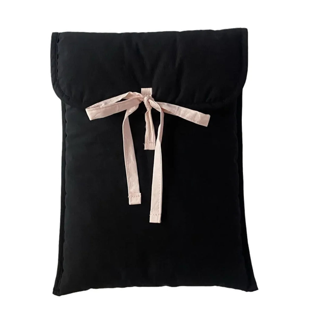 Women's black quilted computer bag with striped pattern and ballet bow detail