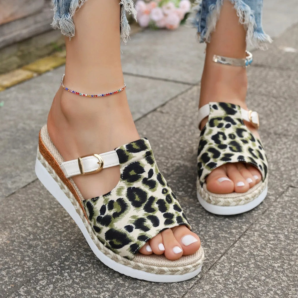 Beige leopard print wedge platform sandals with fish mouth toe opening on a white background.