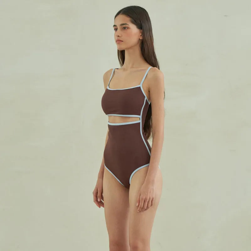 Brown women's one-piece swimsuit with triangle bust style on a mannequin.