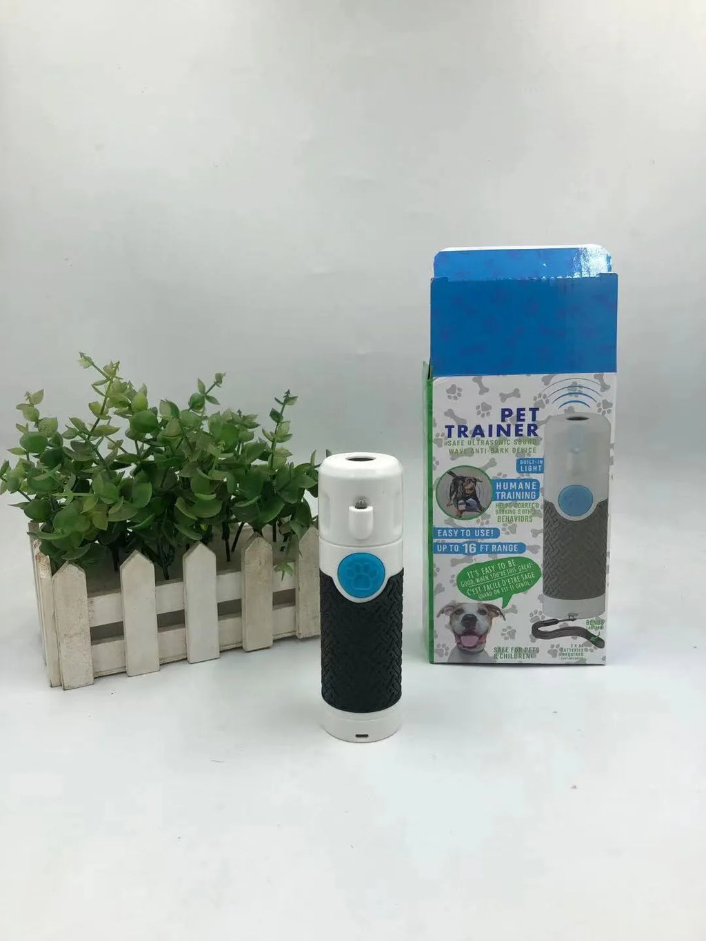 White handheld ultrasonic dog trainer device for bark control and behaviour correction