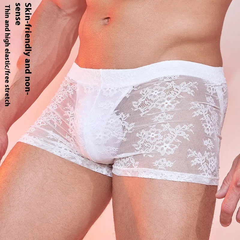 Men's black nylon boxer briefs with a white lace design detail on the front.