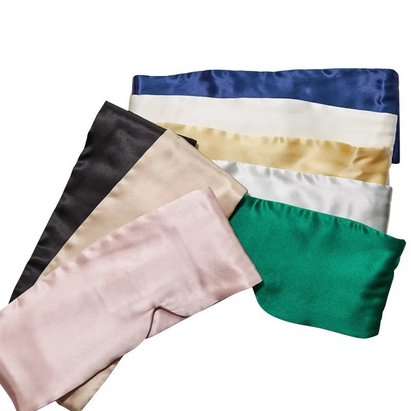 Mulberry silk sleep eye mask shown in one of seven colours: black, champagne gold, green, navy, pink, silver grey, or white.