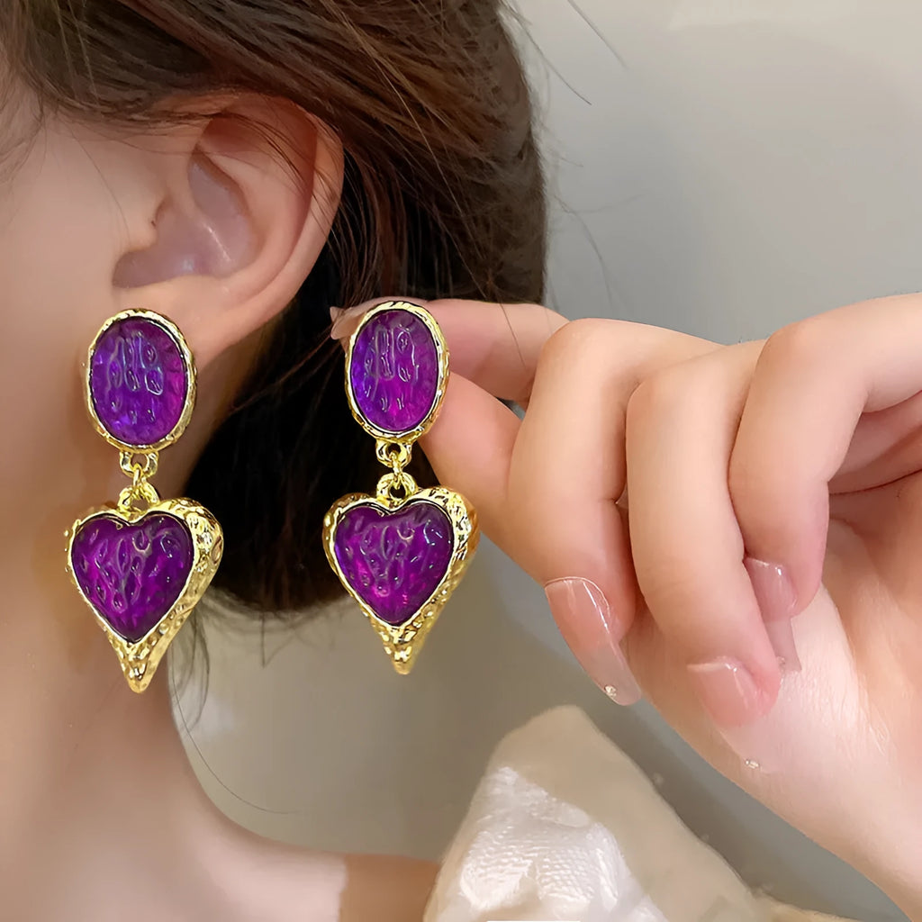 Silver needle pleated oval love heart alloy stud earrings in purple, red, green, and yellow-white.