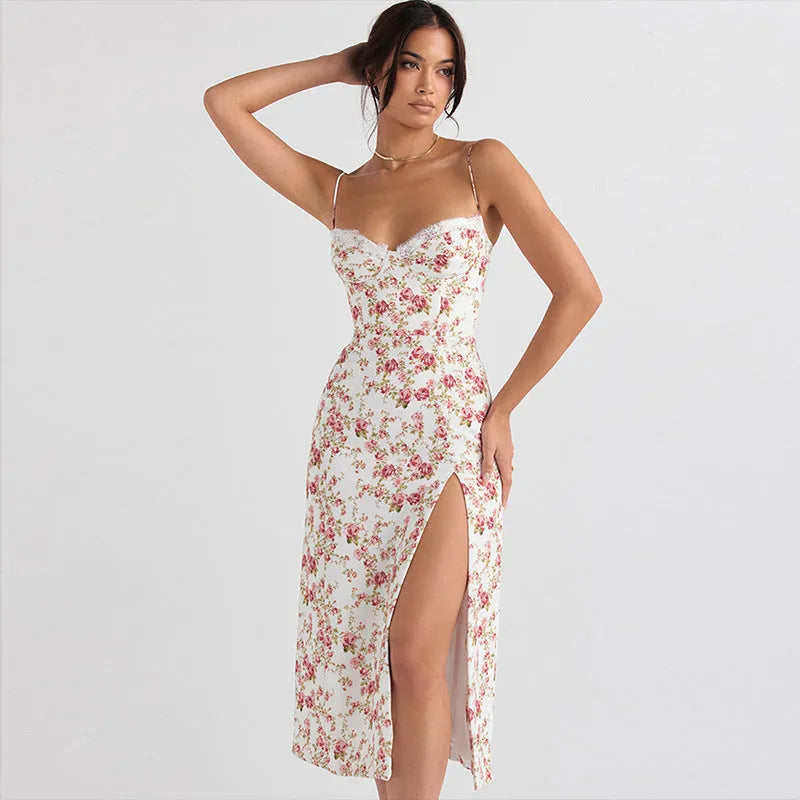 Women's long dress with lace flower print, high split, and suspender straps in blue colour.