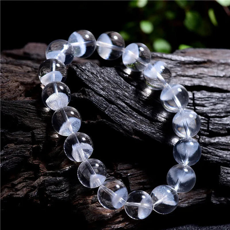 Women's white crystal pyramid ghost bracelet with Ruyi charm showing multiple bead size options