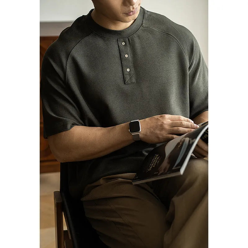 Men's smoky gray casual pullover top with raglan sleeves and a textured fabric.