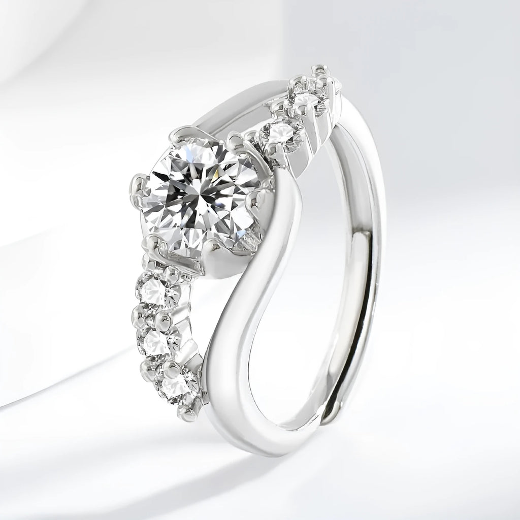 White gold colour crown-shaped copper ring on a plain background