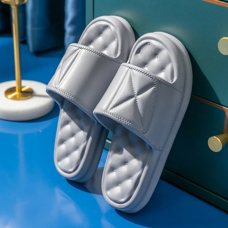 Pair of EVA bathroom slippers with thick non-slip sole shown in colour options.