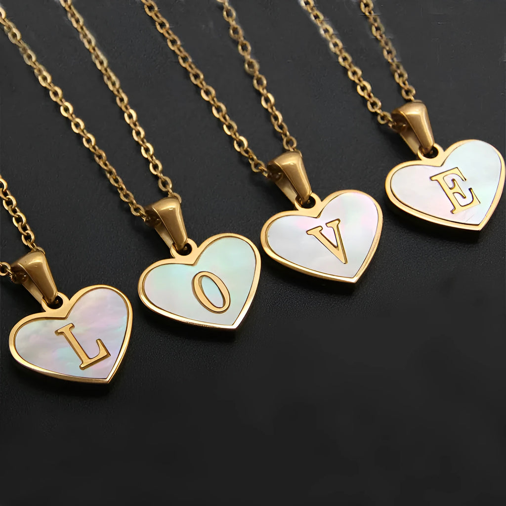Gold heart necklace with white shell centre on stainless steel chain