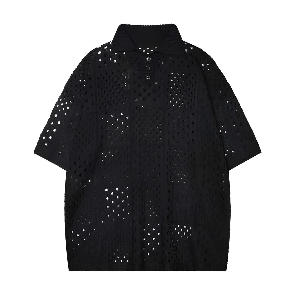 Man wearing a black loose-fit knitted short-sleeve polo shirt with a collar and button placket.