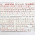 Full set of black PBT key caps for a mechanical keyboard with over 98 keys.