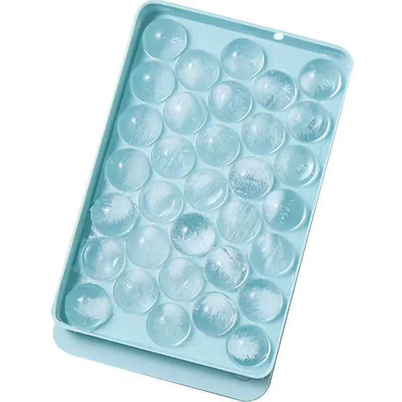 Blue silicone ice cube tray with lid showing 33 round grids for large ice cubes