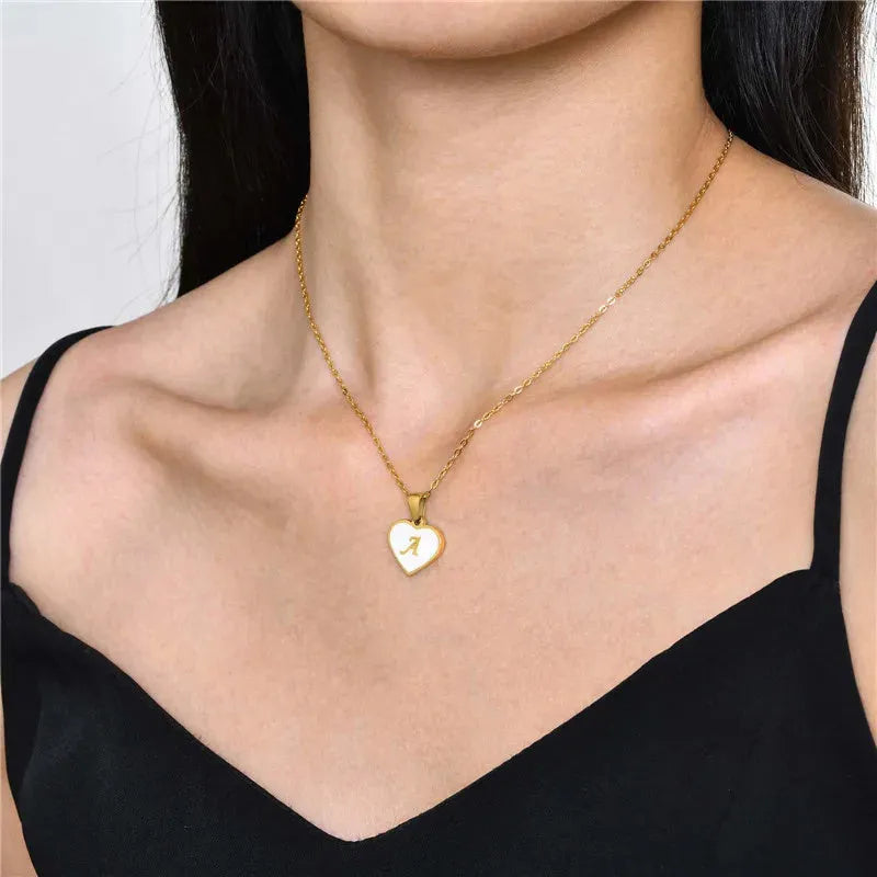 Gold heart necklace with white shell centre on stainless steel chain