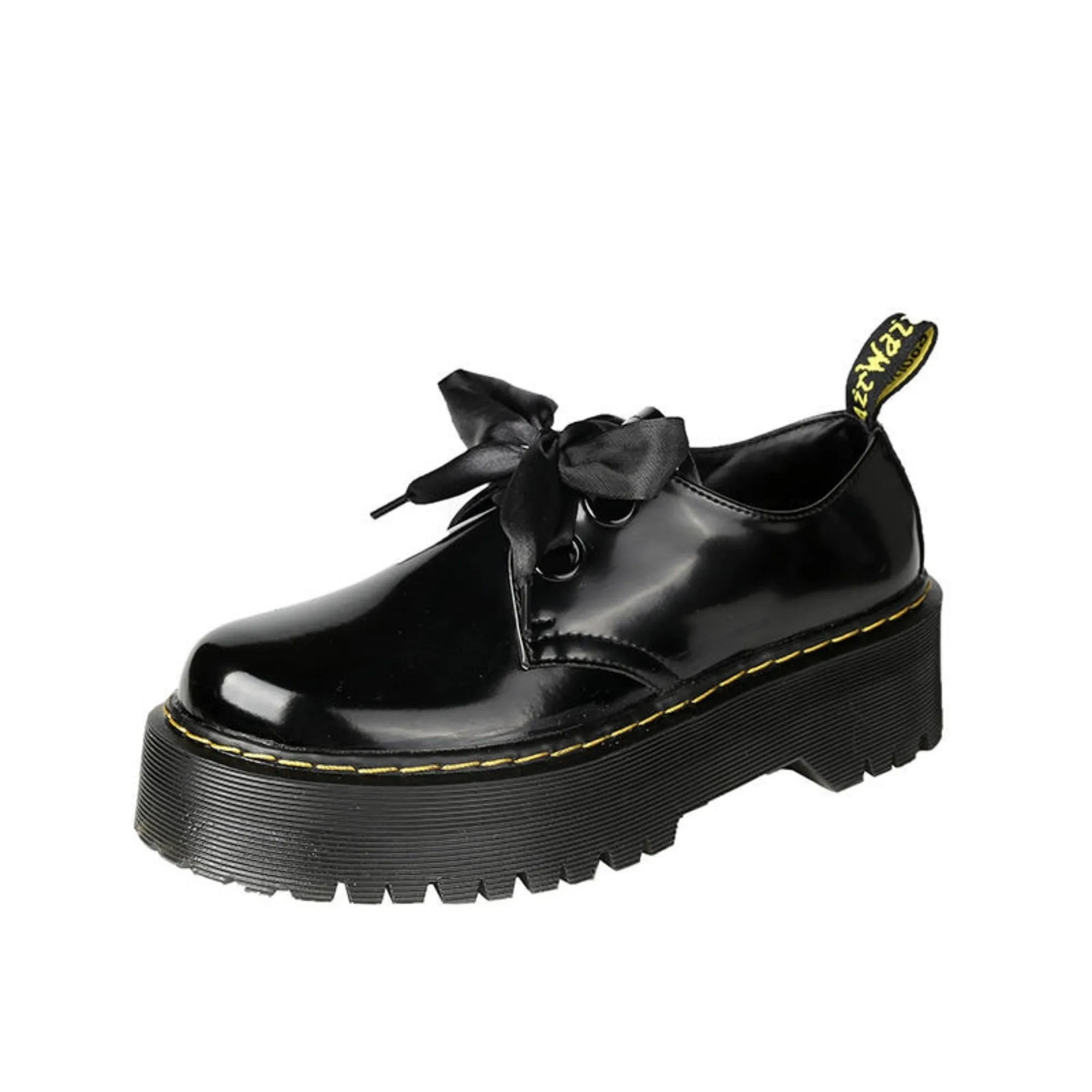Women's white lace-up leather shoes with thick soles and black cross straps on the ankle.