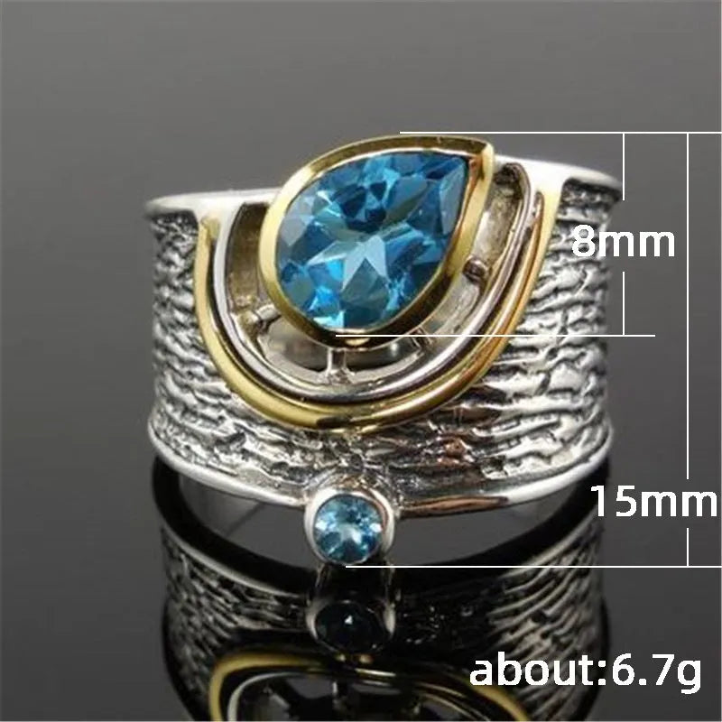 Blue zircon drop shape ring in Creative Chinese Style design, showing inlaid stones on an alloy band.