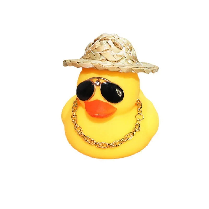 Straw hat yellow duck cartoon car dashboard ornament with adhesive gel and sunglasses necklace.