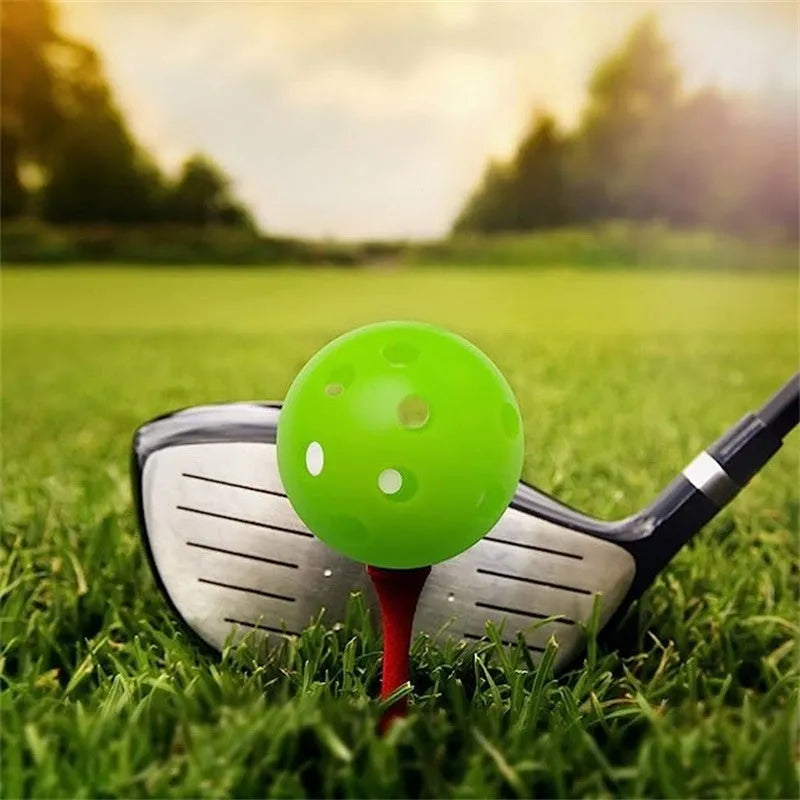 Six different coloured golf practice balls showing red, orange, blue, green, white and yellow variations with net bag packaging