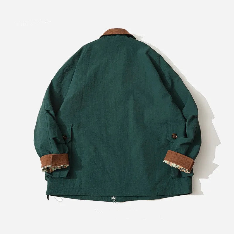 Green solid colour casual jacket with long sleeves and side seam pockets on a hanger