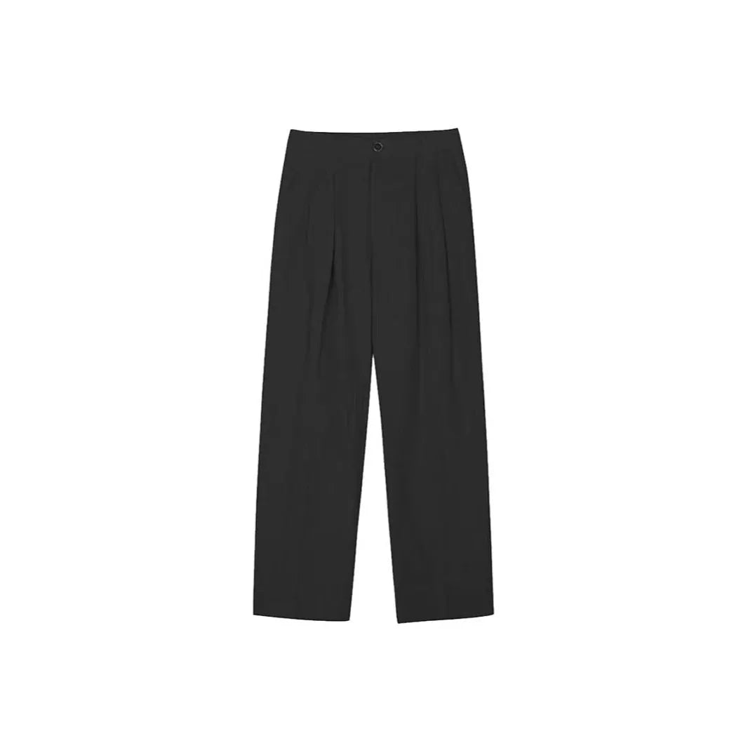 Men's lightweight apricot coloured loose-fit linen trousers laid flat, showing zip fly and relaxed leg style.