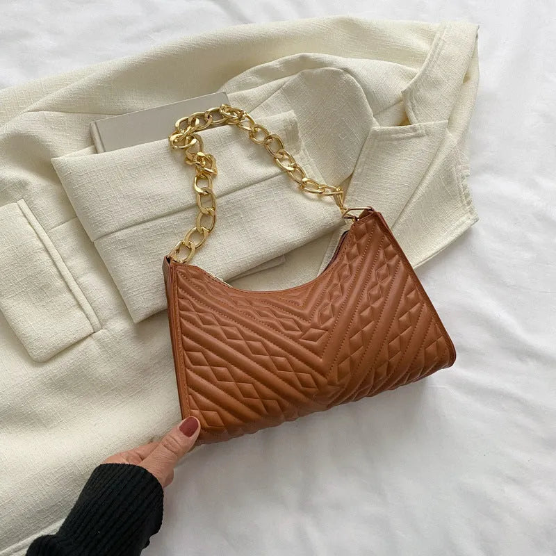 Brown pleated PU leather vertical square shoulder bag with a chain strap and soft handle.