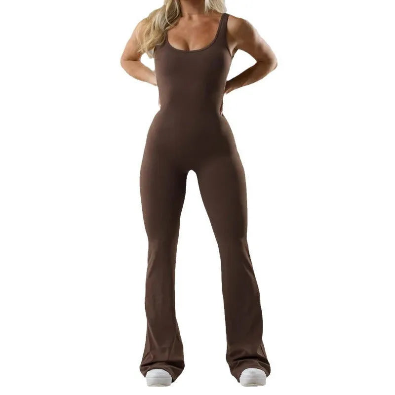 Women's black seamless yoga bodysuit jumpsuit with mid waist and trousers length.