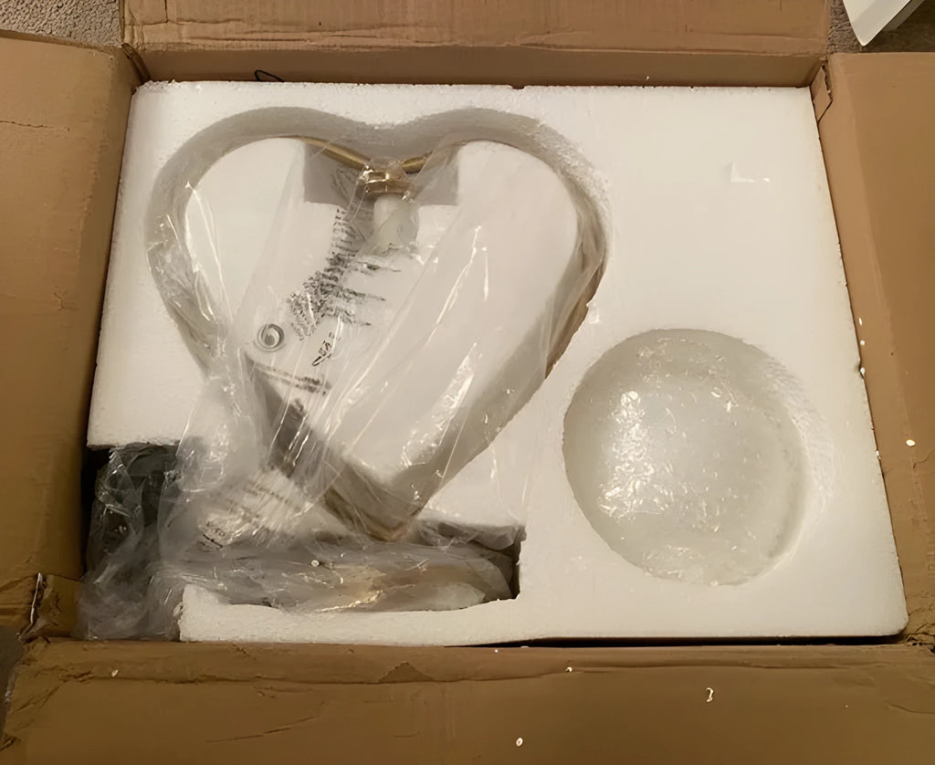 White heart-shaped LED lamp with warm glow on wooden surface