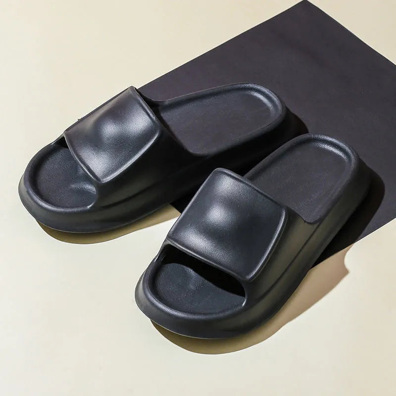 Thick-soled EVA foam flip-flop slippers for men and women in assorted colours on a white background.
