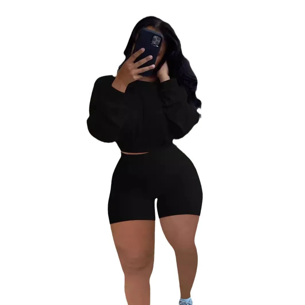 Women's off-the-shoulder long sleeve top and matching shorts in a sunken stripe solid colour two-piece set.