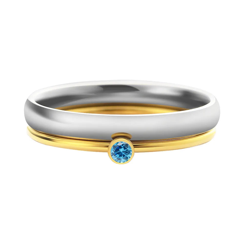 December birthstone engraved ring in titanium steel with gold accents and a geometry shape.