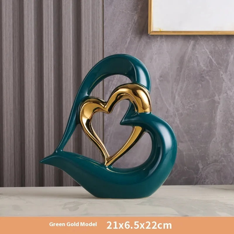 White porcelain love heart ornament in modern geometric style with 1939 Black Gold colour finish on shelf