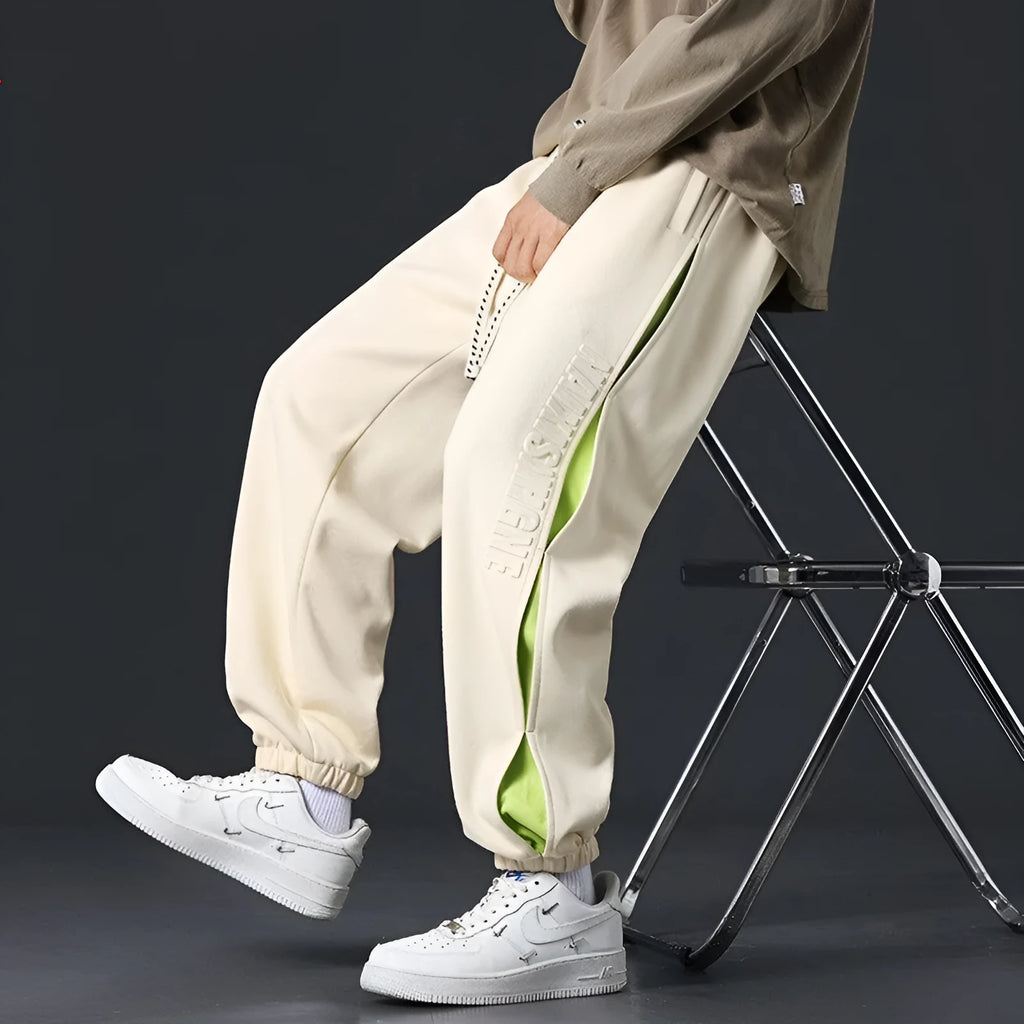 Men's cotton trousers with ankle bands and stitching detail in grey green colour