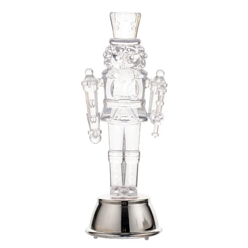 Transparent plastic soldier nutcracker Christmas decoration on desktop