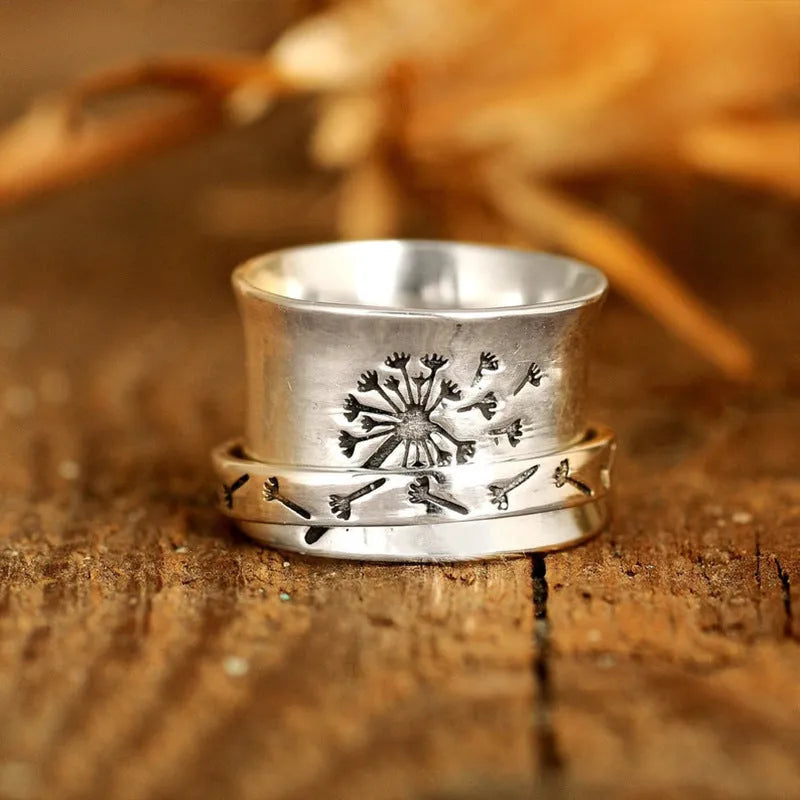 Silver electroplated rotatable flower ring showing floral design on alloy band