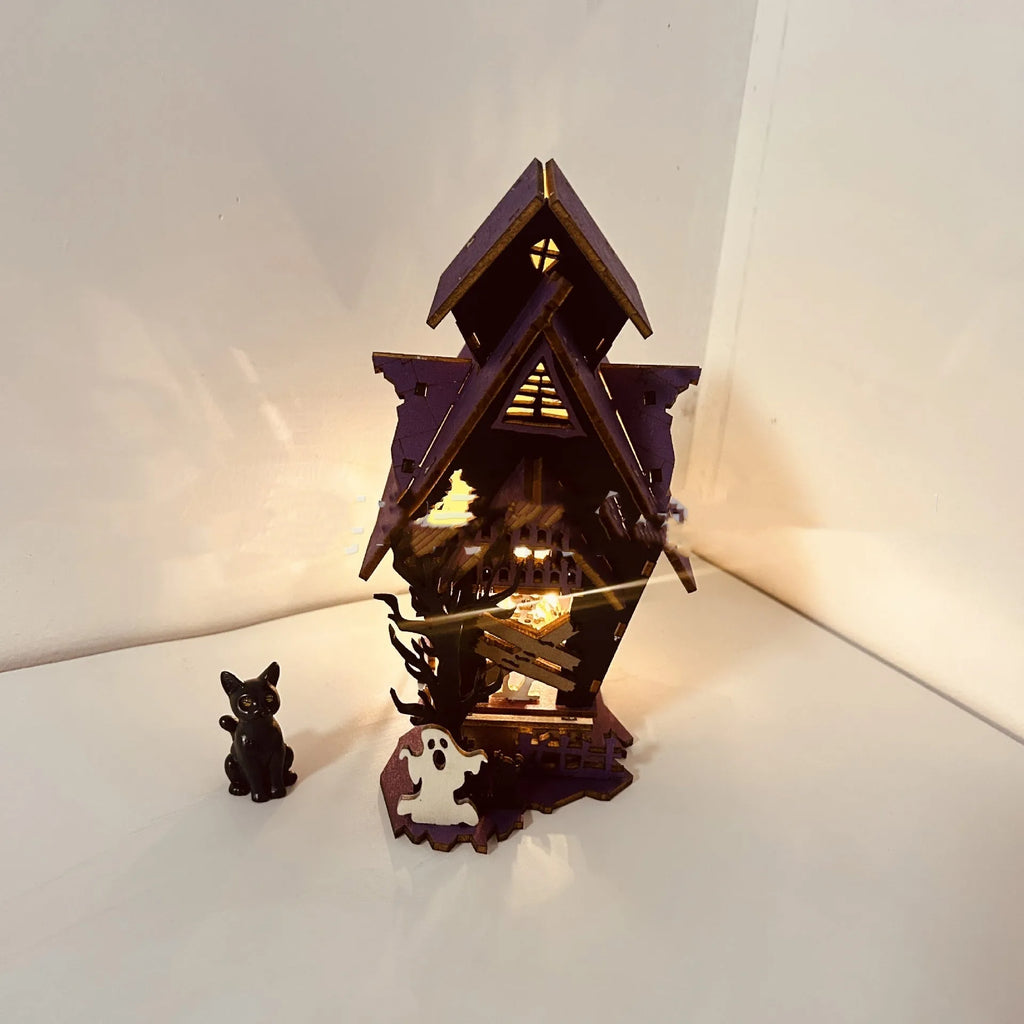 Unpainted wooden haunted house Halloween decoration measuring 14cm wide by 19cm tall