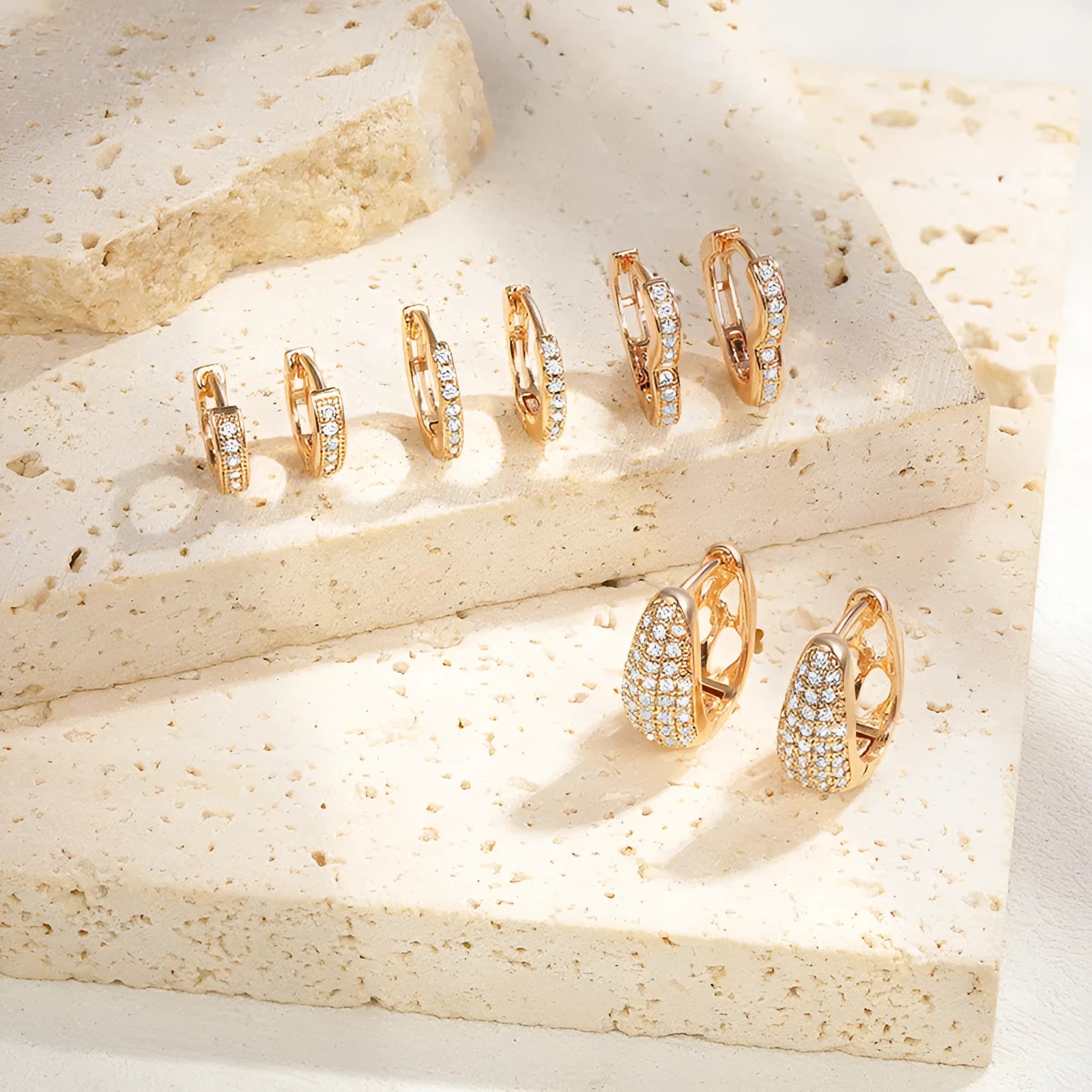 Brass gold-plated heart-shaped ear clip earrings with gang drill detailing and electroplated finish