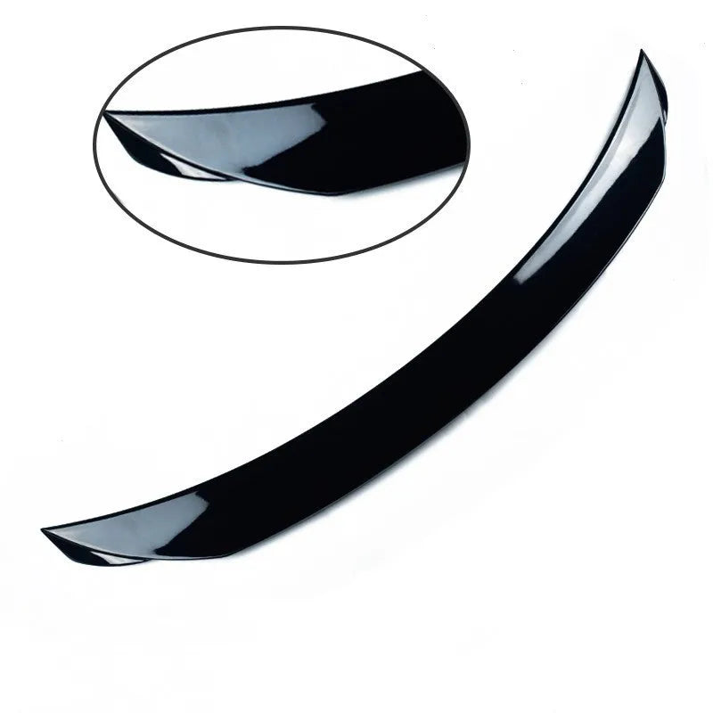 Large bright black tail blade spoiler for a Mazda 3 Axela car, showing wind-surrounded design.