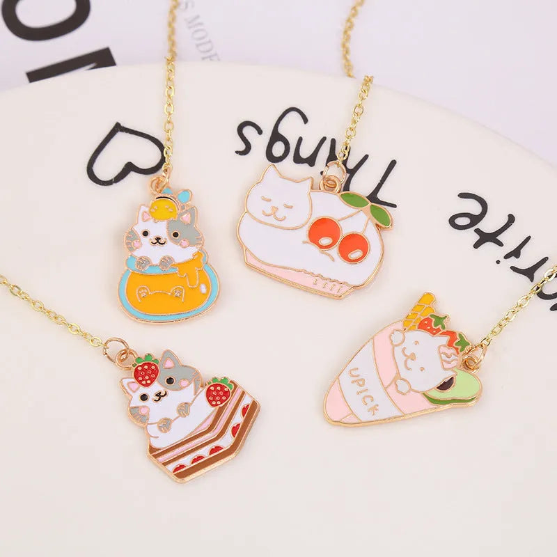 Jane Lime metal pendant cat cartoon bookmark in four colourful designs on a white background.