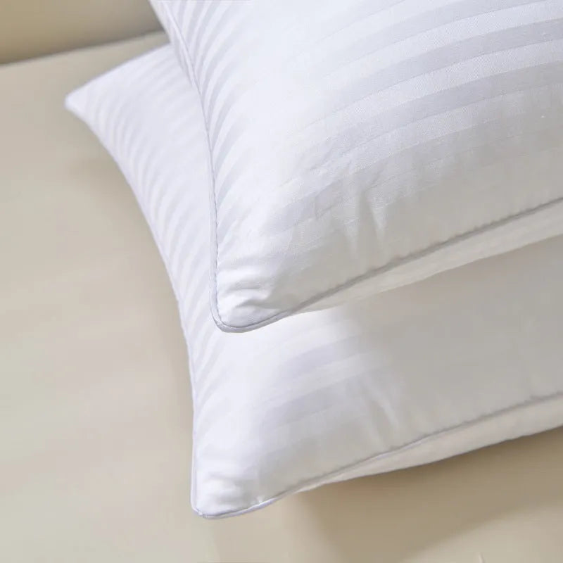 White feather pillow with cotton satin stripe pillowcase showing three size options