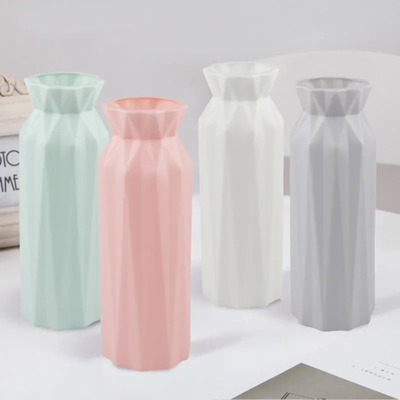 Grey melamine plastic vase with a wide 7.2cm base on a wooden table.