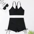 Women's black high waist split swimsuit bikini set with briefs shorts on a mannequin.